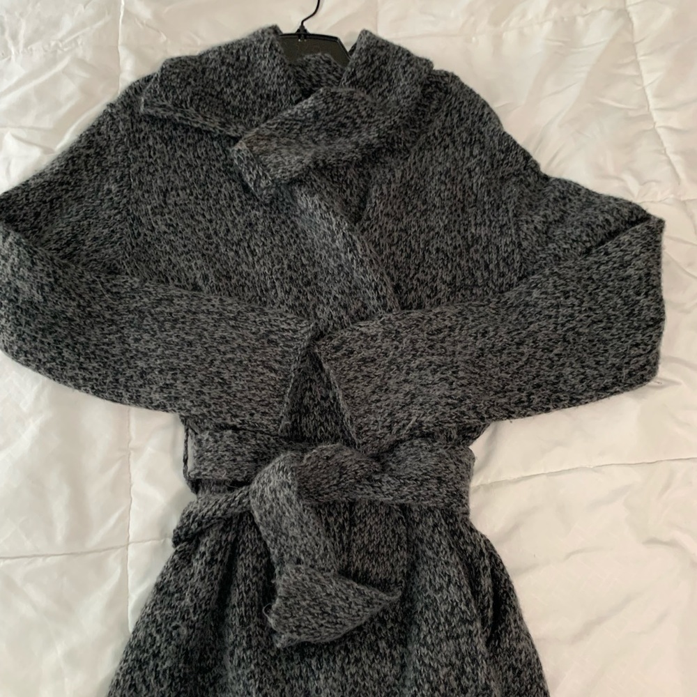 Grey tie sweater.